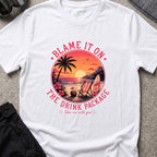 Blame It On The Drink Package — Sunset Beach T-Shirt in White, front view.