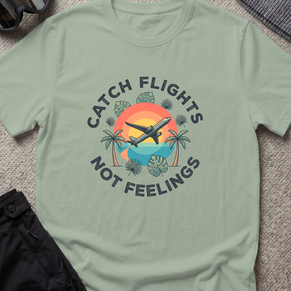 Catching Flights not Feelings T-Shirt in Sage, front view.