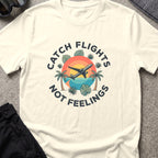 Catching Flights not Feelings T-Shirt in Natural, front view.