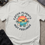 Catching Flights not Feelings T-Shirt in Ice Grey, front view.