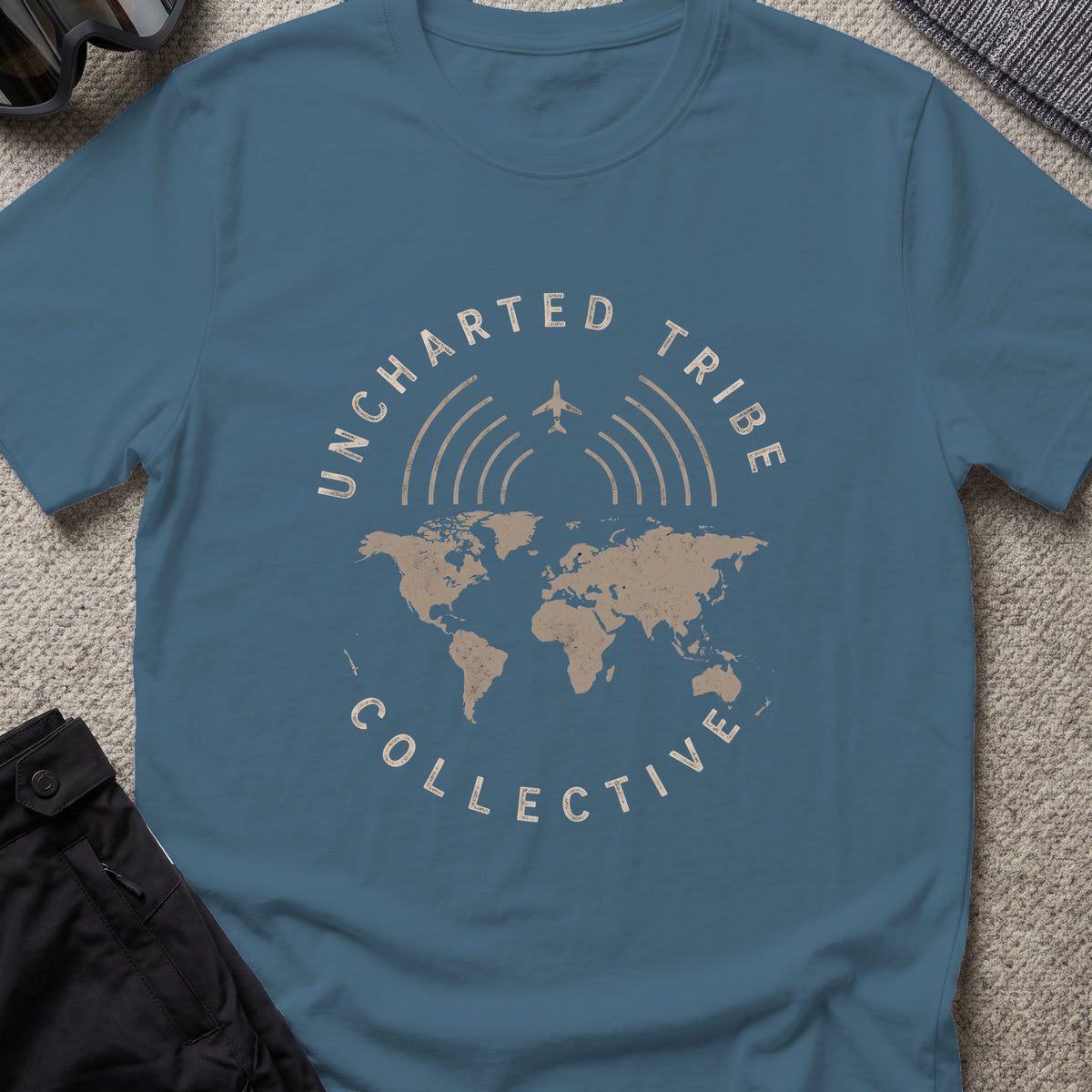 Uncharted Tribe Collective Global T-Shirt in Indigo Blue, front view.
