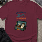 My Luggage is Mostly Souvenirs T-Shirt in Maroon, front view.
