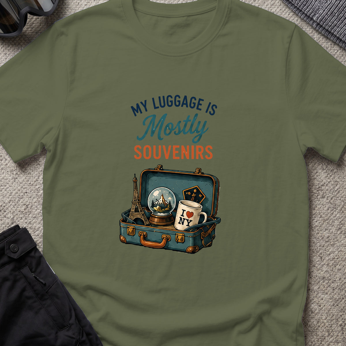 My Luggage is Mostly Souvenirs T-Shirt in Military Green, front view.