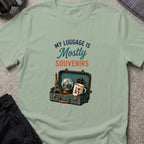 My Luggage is Mostly Souvenirs T-Shirt in Sage, front view.