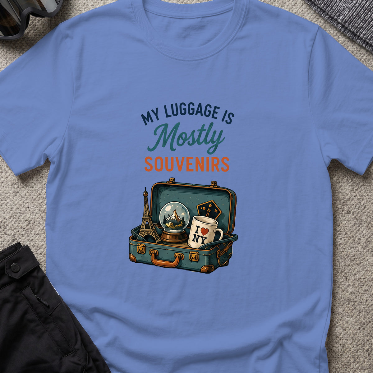 My Luggage is Mostly Souvenirs T-Shirt in Iris, front view.
