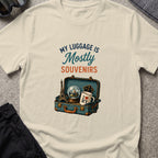 My Luggage is Mostly Souvenirs T-Shirt in Sand, front view.