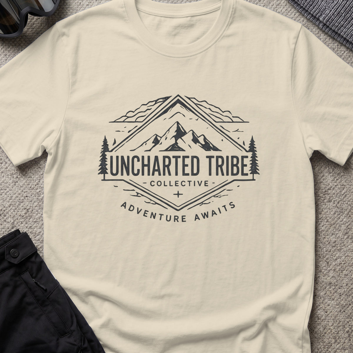 Adventure Awaits T-Shirt — Mountain Crest in Sand, front view.