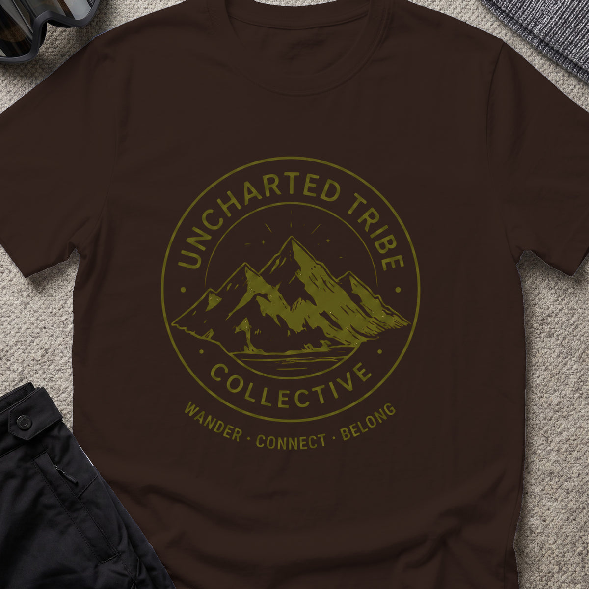 Uncharted Tribe Collective T-Shirt — Mountain Seal in Dark Chocolate, front view.