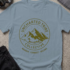 Uncharted Tribe Collective T-Shirt — Mountain Seal in Stone Blue, front view.