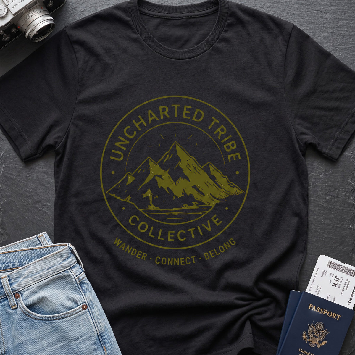Uncharted Tribe Collective T-Shirt — Mountain Seal in Black, front view.