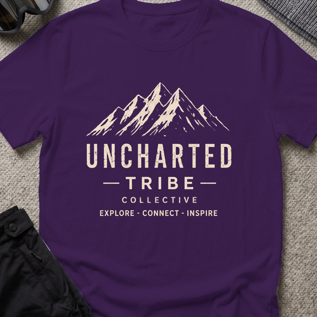 Uncharted Tribe Collective T-Shirt — Summit Wordmark in Purple, front view.