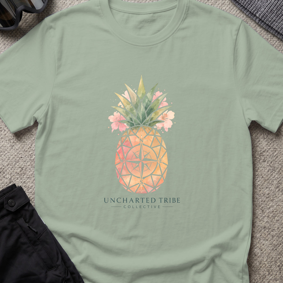 Uncharted Tribe Collective Unisex Pineapple T-Shirt in Sage, front view.
