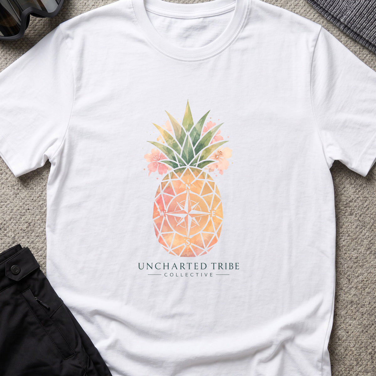 Uncharted Tribe Collective Unisex Pineapple T-Shirt in White, front view.