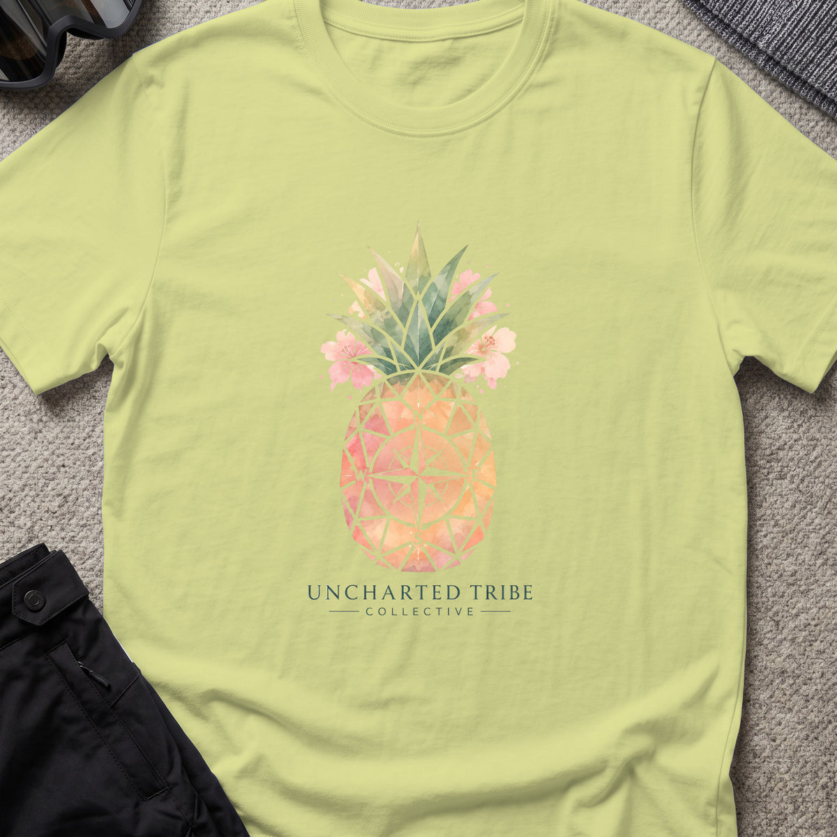 Uncharted Tribe Collective Unisex Pineapple T-Shirt in Pistachio, front view.