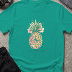 Uncharted Tribe Collective Unisex Pineapple T-Shirt in Jade Dome, front view.