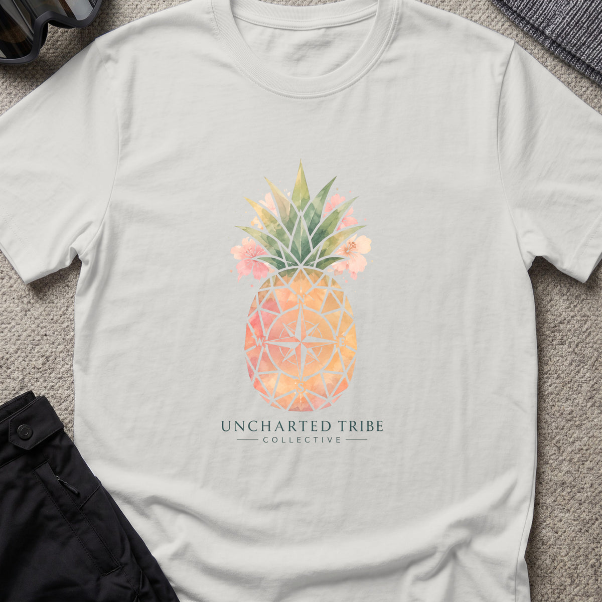 Uncharted Tribe Collective Unisex Pineapple T-Shirt in Ice Grey, front view.