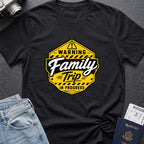 Warning Family Trip in Progress T-Shirt in Black, front view.