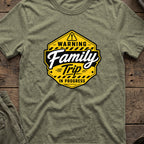 Warning Family Trip in Progress T-Shirt in Heather Military Green, front view.