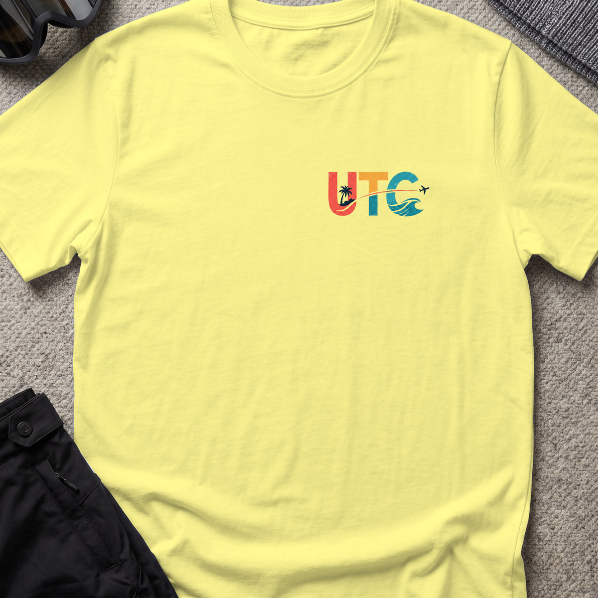 Uncharted Tribe Collective T-Shirt — Shoreline Seal in Cornsilk, front view.