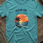 Ocean Air Don't Care T-Shirt in Heather Galapagos Blue, front view.
