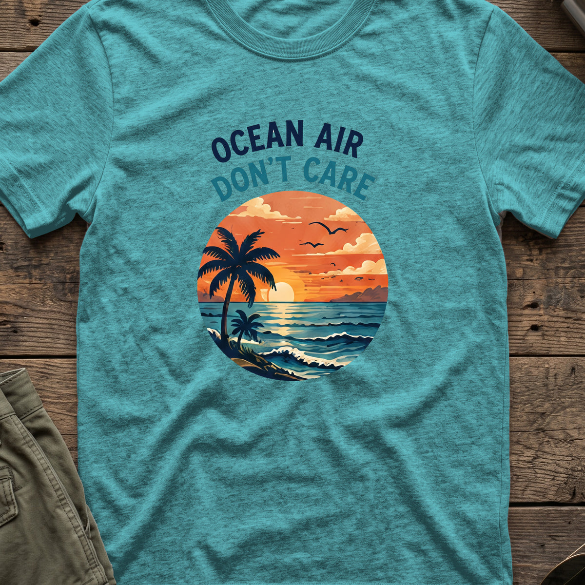Ocean Air Don't Care T-Shirt in Heather Galapagos Blue, front view.