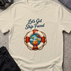 Let's Get Ship Faced T-Shirt — Ocean View in Sand, front view.