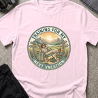 Training for My Next Vacation T-Shirt in Light Pink, front view.