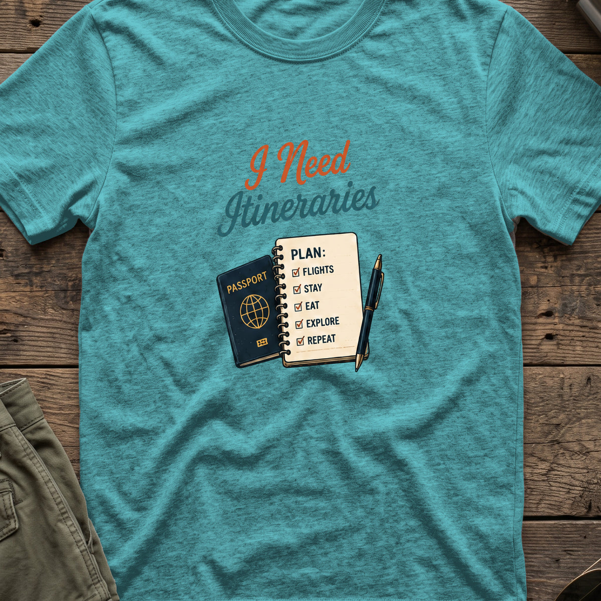 I Need Itineraries T-Shirt in Heather Galapagos Blue, front view.