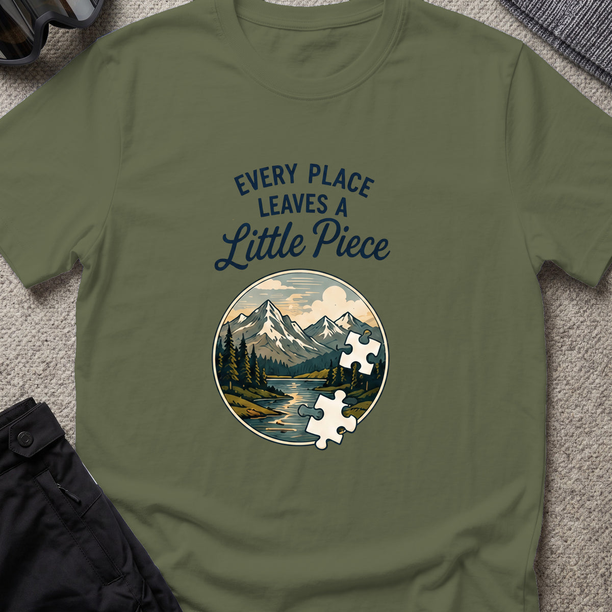 Every Place Leaves a Little Piece T-Shirt in Military Green, front view.