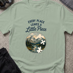 Every Place Leaves a Little Piece T-Shirt in Sage, front view.