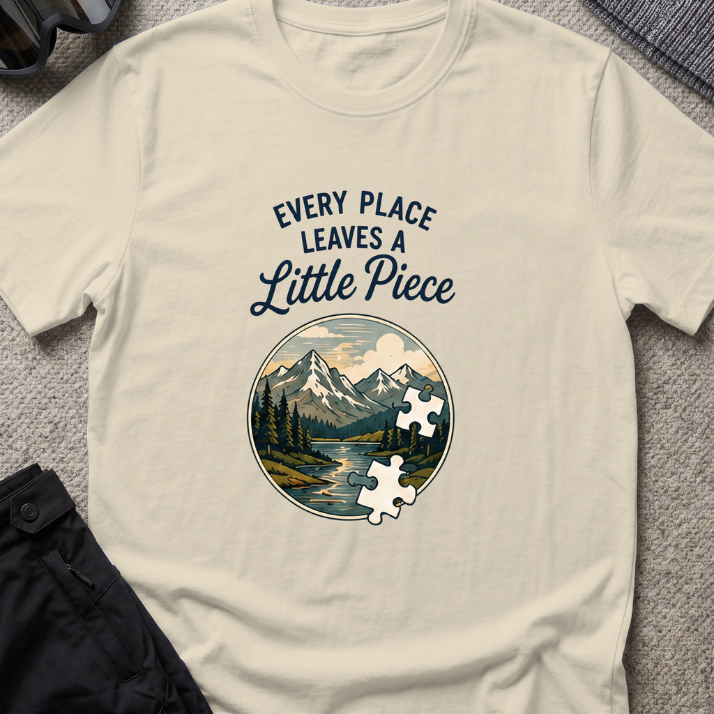 Every Place Leaves a Little Piece T-Shirt in Sand, front view.