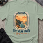 Adventure Awaits T-Shirt — Window Seat in Sage, front view.