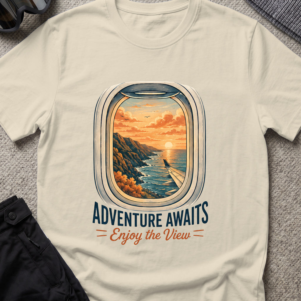 Adventure Awaits T-Shirt — Window Seat in Sand, front view.