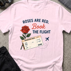 Roses are Red, Book the Flight T-Shirt in Light Pink, front view.