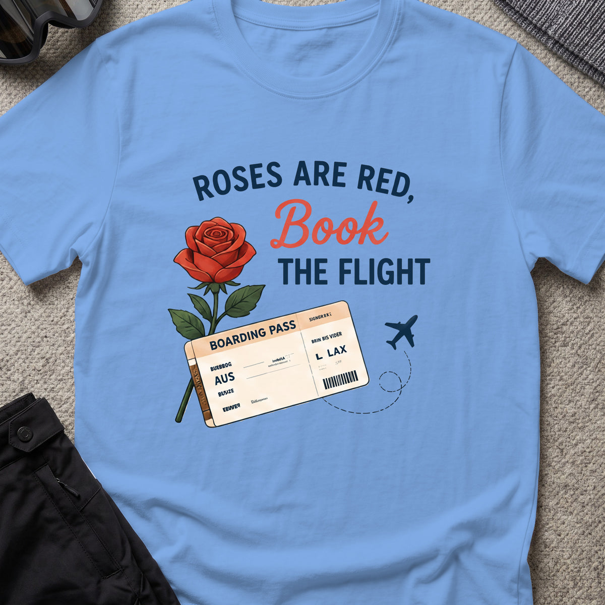 Roses are Red, Book the Flight T-Shirt in Carolina Blue, front view.