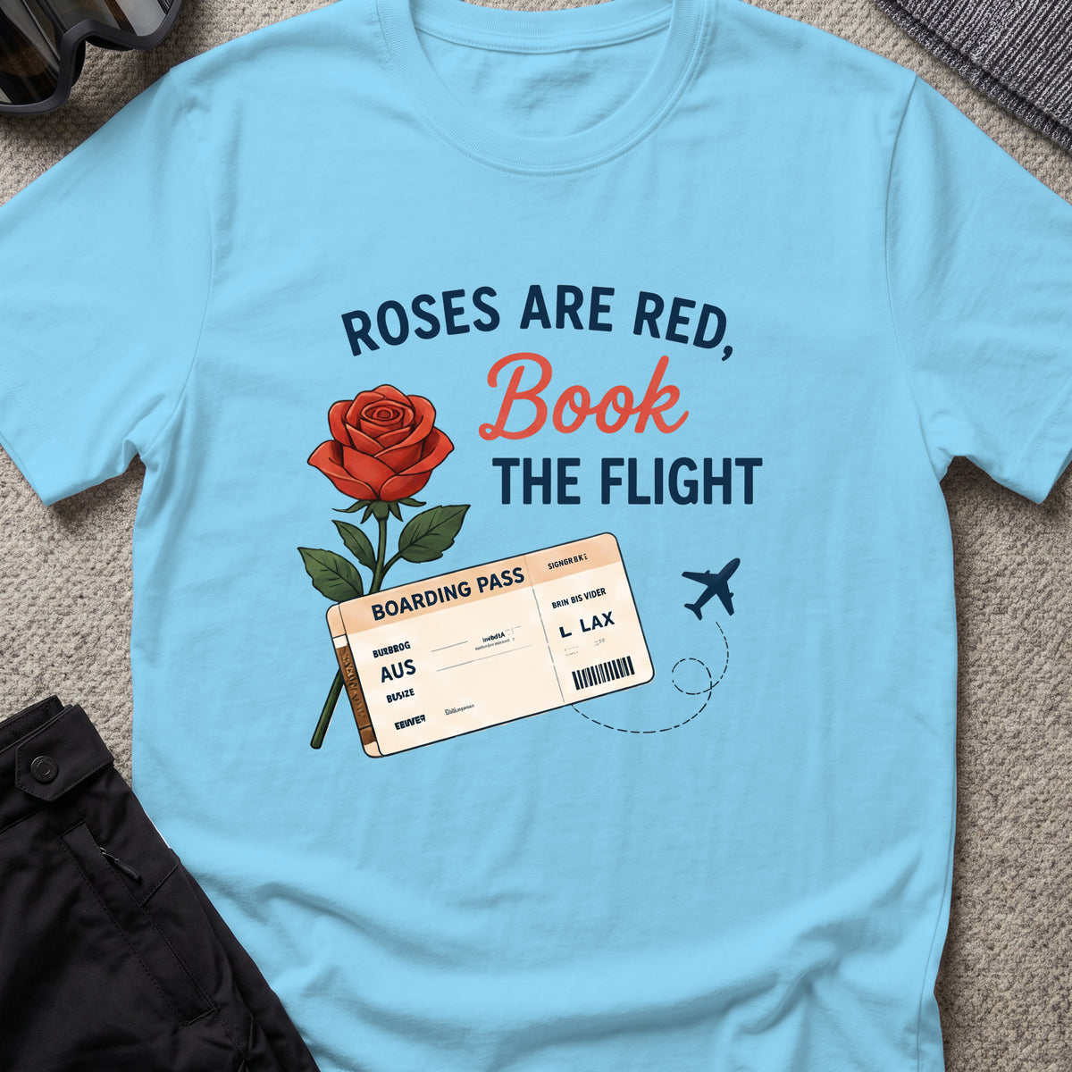 Roses are Red, Book the Flight T-Shirt in Sky, front view.