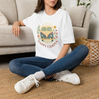 Floral Camper Van 2 T-Shirt in White, front view on a seated model.
