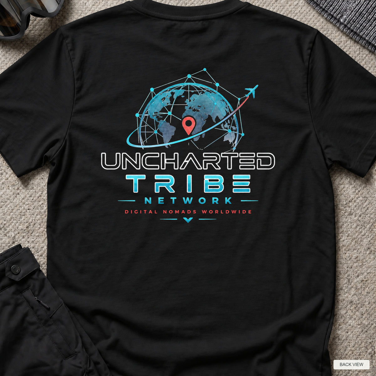 Uncharted Tribe Network — Cyber Tee in Black, back view showing the printed rear design on a flat-laid T-shirt.