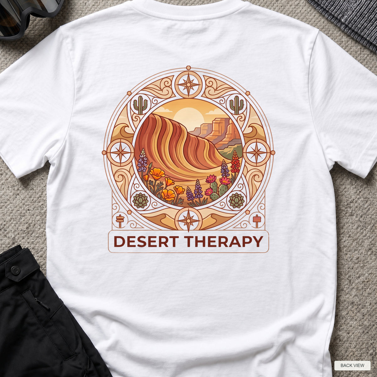 Desert Therapy T-Shirt — Desert Arch in White, back view showing the printed rear design on a flat-laid T-shirt.