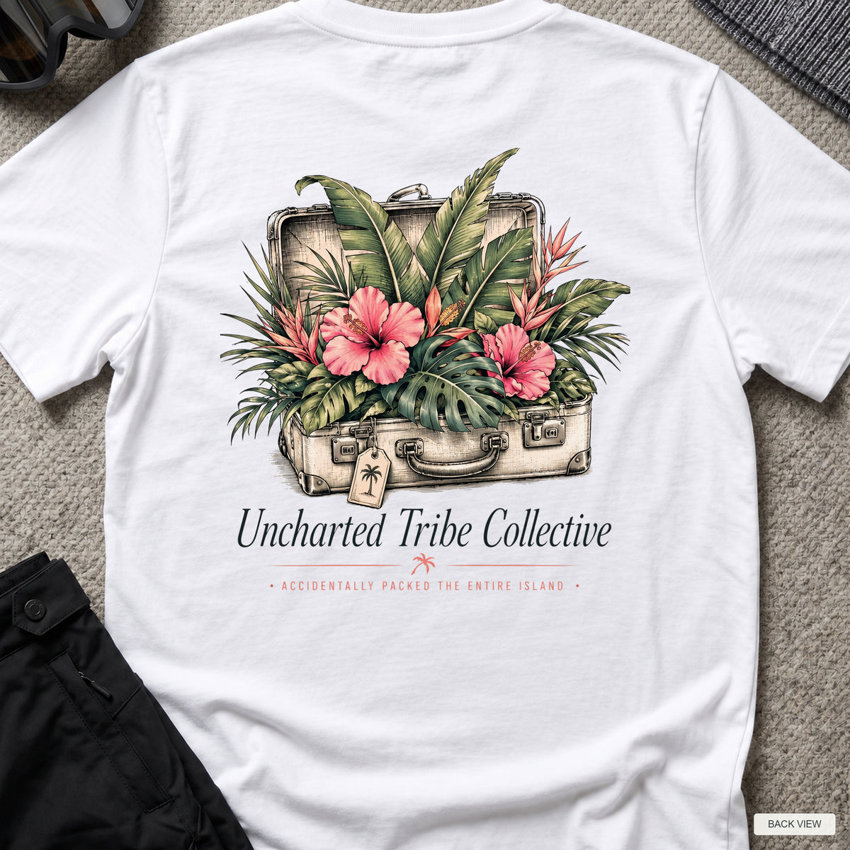 Packed the Island T-Shirt in White, back view showing the printed rear design on a flat-laid T-shirt.